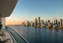 Miami Is Still the Top U.S. Global Buyer Market. What Foreign Investors Should Do Differently in 2026 Miami waterfront skyline viewed from an elegant condominium balcony for an international buyer market article.