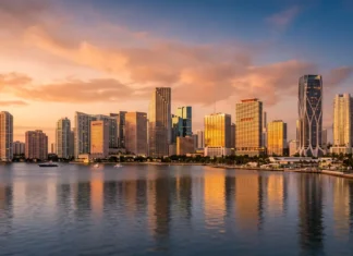 Miami’s Two Migration Stories: What the 2026 Market Report Card Means If You’re Buying Now Editorial view of the Miami skyline with residential towers and the urban core, illustrating the city's two-speed housing market